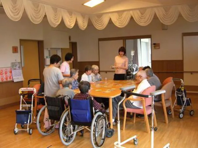 Easy-to-join design of tables and chairs in a multi-functional hall in a Japanese elderly care facility